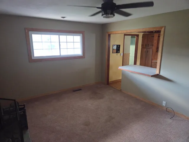 a view of an empty room with a window