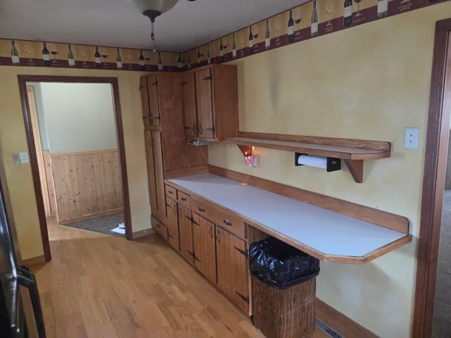 a bathroom with a sink a mirror and a shower