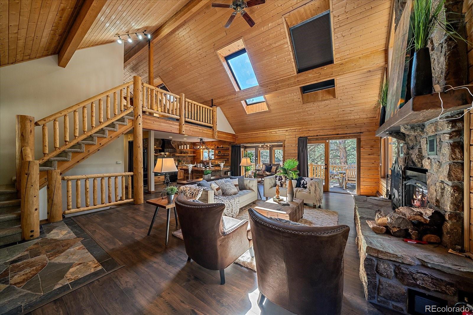 1385 Beaver Brook Canyon Road Evergreen, CO 80439 - Photo 11 of 49 a view of a dining room with furniture window and entryway