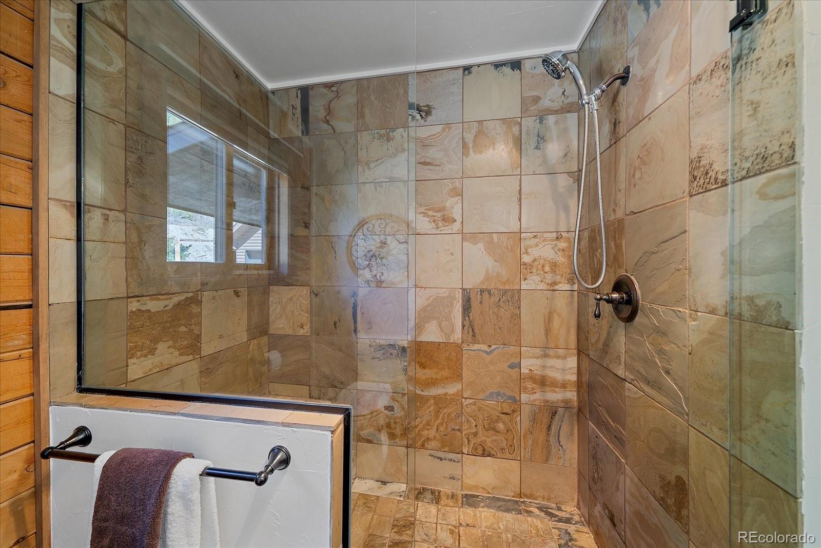 1385 Beaver Brook Canyon Road Evergreen, CO 80439 - Photo 21 of 49 a bathroom with a shower