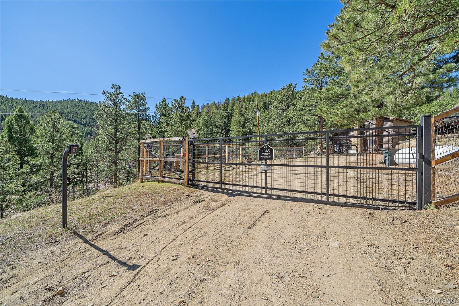 1385 Beaver Brook Canyon Road Evergreen, CO 80439 - Photo 3 of 49 a view of a backyard