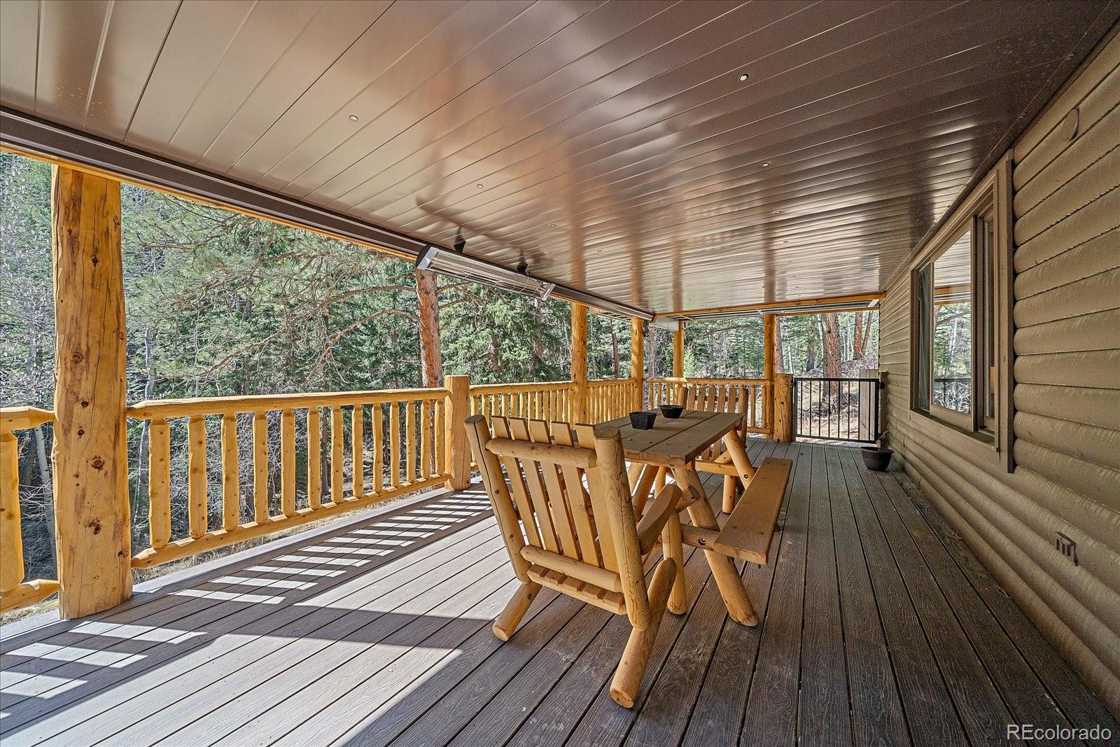 1385 Beaver Brook Canyon Road Evergreen, CO 80439 - Photo 38 of 49 a view of a two chairs in the balcony