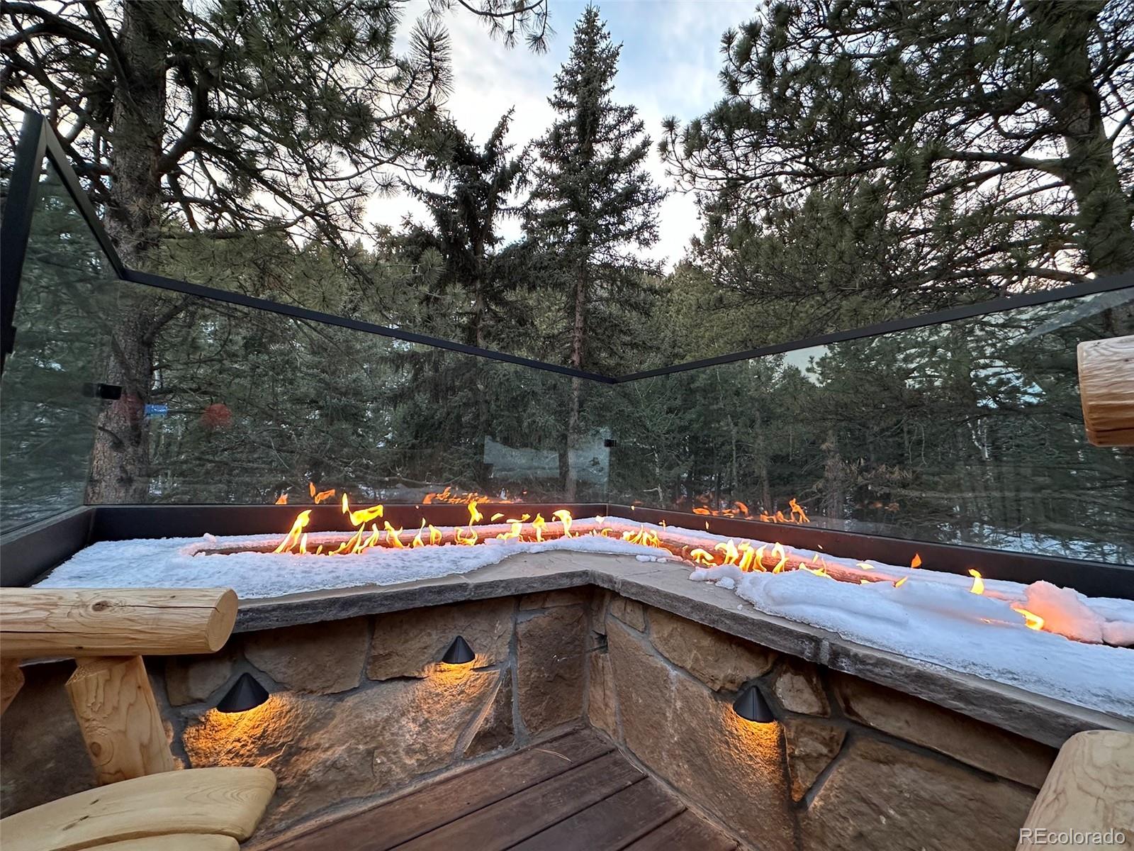 1385 Beaver Brook Canyon Road Evergreen, CO 80439 - Photo 45 of 49 a outdoor view with sitting space and trees