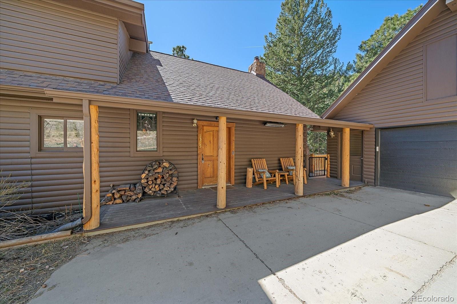 1385 Beaver Brook Canyon Road Evergreen, CO 80439 - Photo 5 of 49 a view of a house with an outdoor space