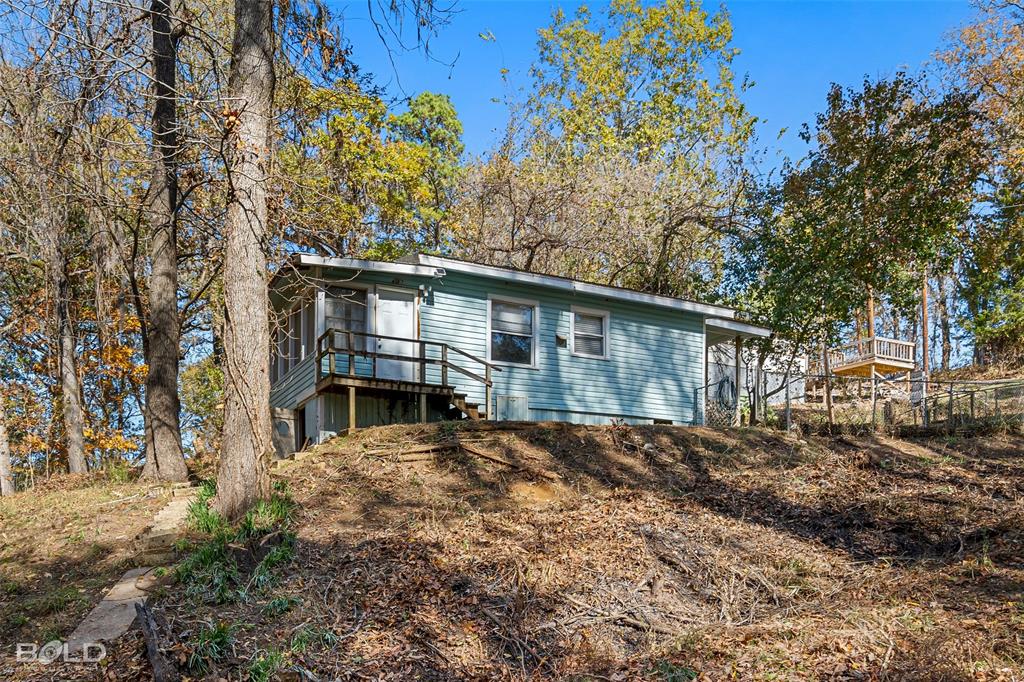 333 Canal Street Ringgold, LA 71068 - Photo 25 of 33 a view of house with a yard