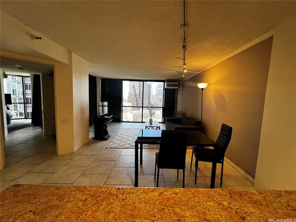 a dining room with furniture and window