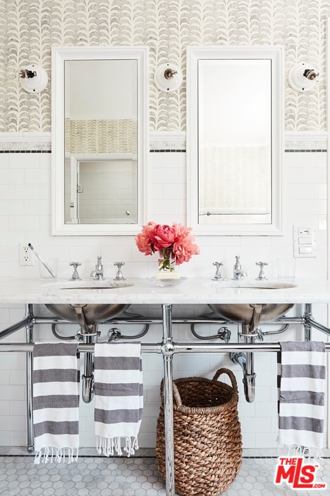 555 South Rimpau Boulevard Los Angeles, CA 90020 - Photo 11 of 17 a bathroom with a sink and a mirror