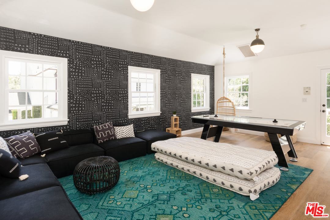 555 South Rimpau Boulevard Los Angeles, CA 90020 - Photo 15 of 17 a living room with furniture and a large window