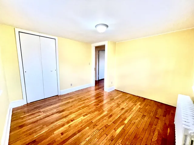 a view of balcony with wooden floor and fence