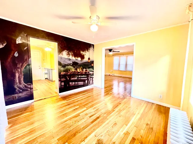 a view of empty room with a flat screen tv