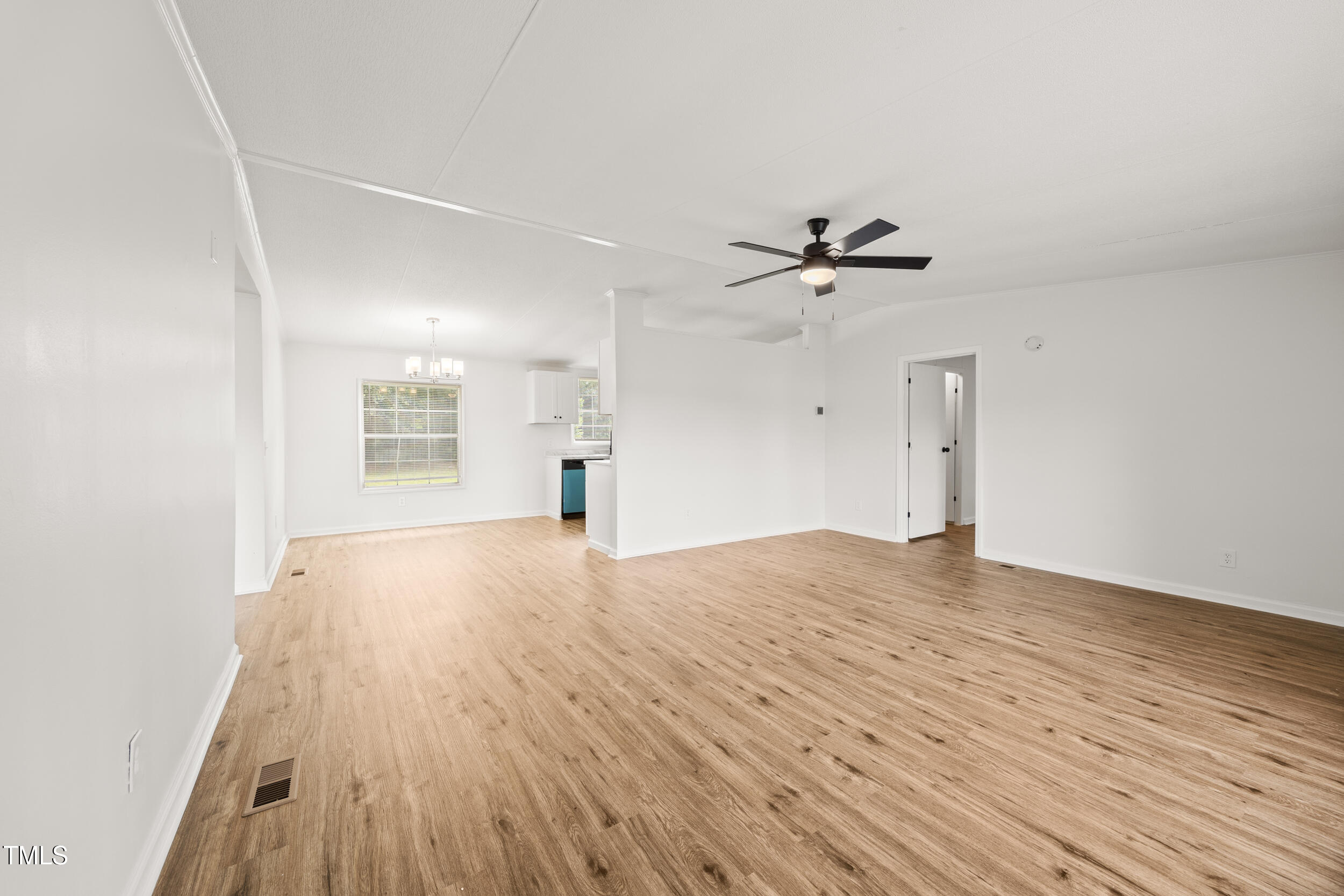 6423 Sandy Creek Road Stedman, NC 28391 - Photo 11 of 40 wooden floor in an empty room with a window