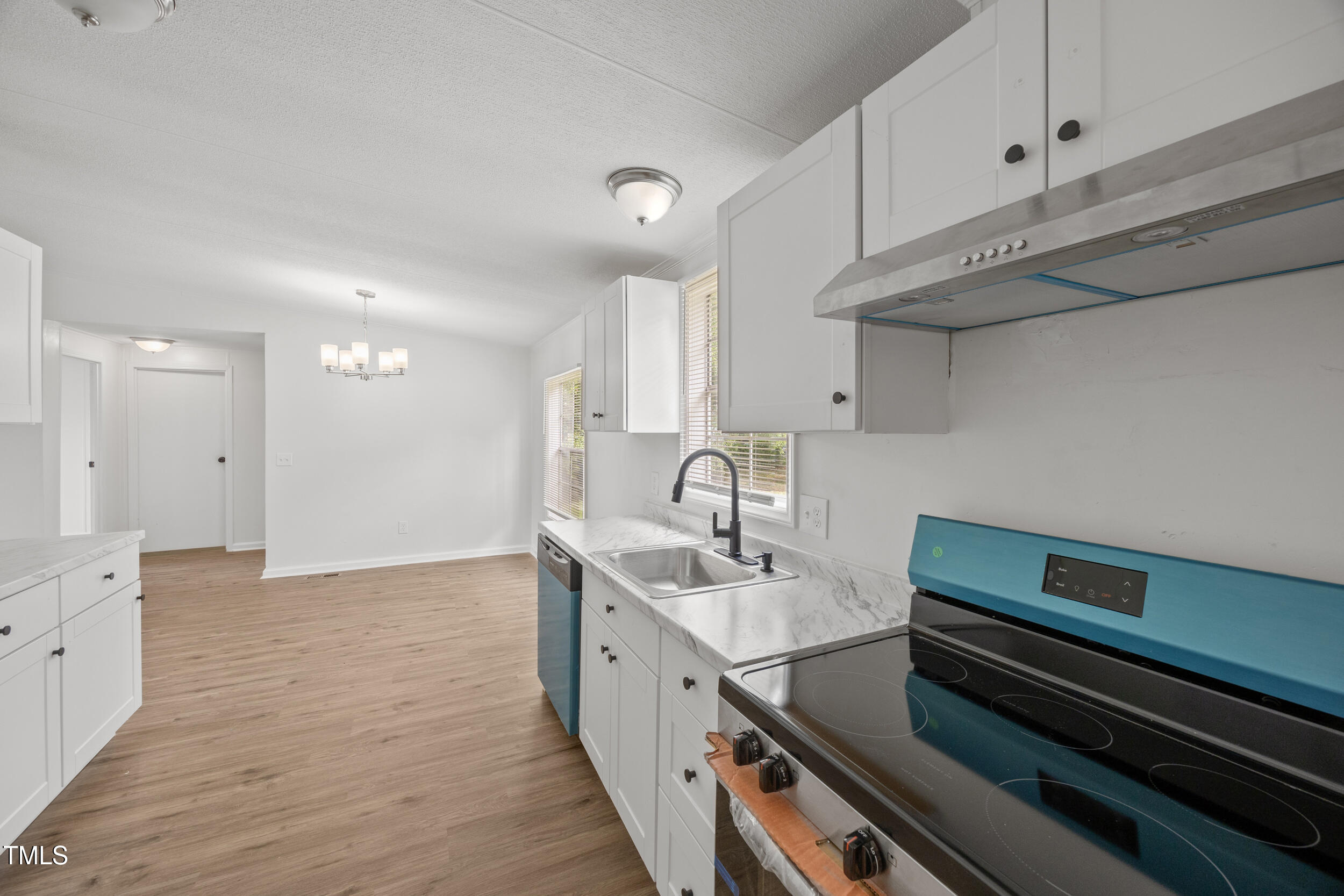 6423 Sandy Creek Road Stedman, NC 28391 - Photo 23 of 40 a kitchen with a sink appliances and cabinets