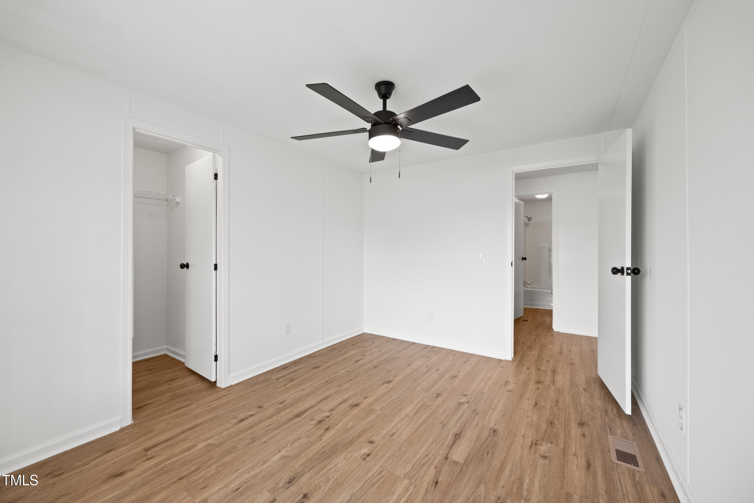 6423 Sandy Creek Road Stedman, NC 28391 - Photo 30 of 40 a view of empty room with wooden floor