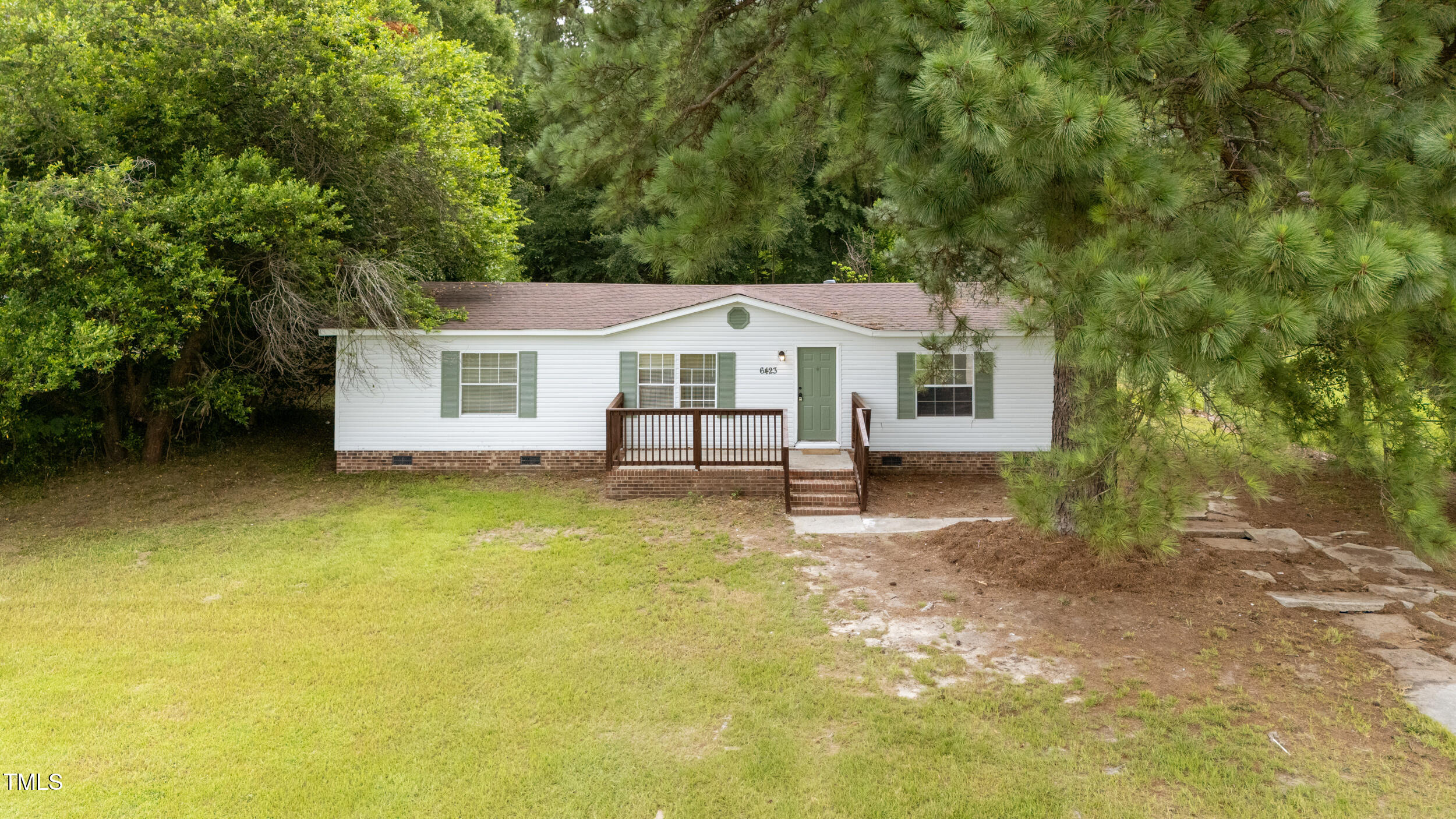 6423 Sandy Creek Road Stedman, NC 28391 - Photo 3 of 40 a house view with a garden space