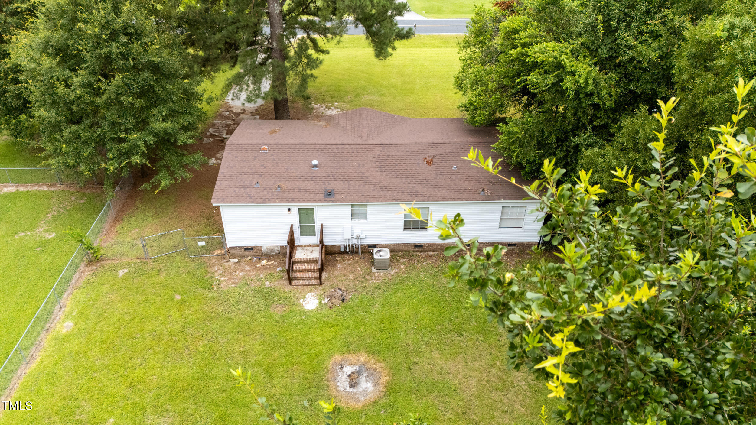 6423 Sandy Creek Road Stedman, NC 28391 - Photo 34 of 40 a view of house with swimming pool
