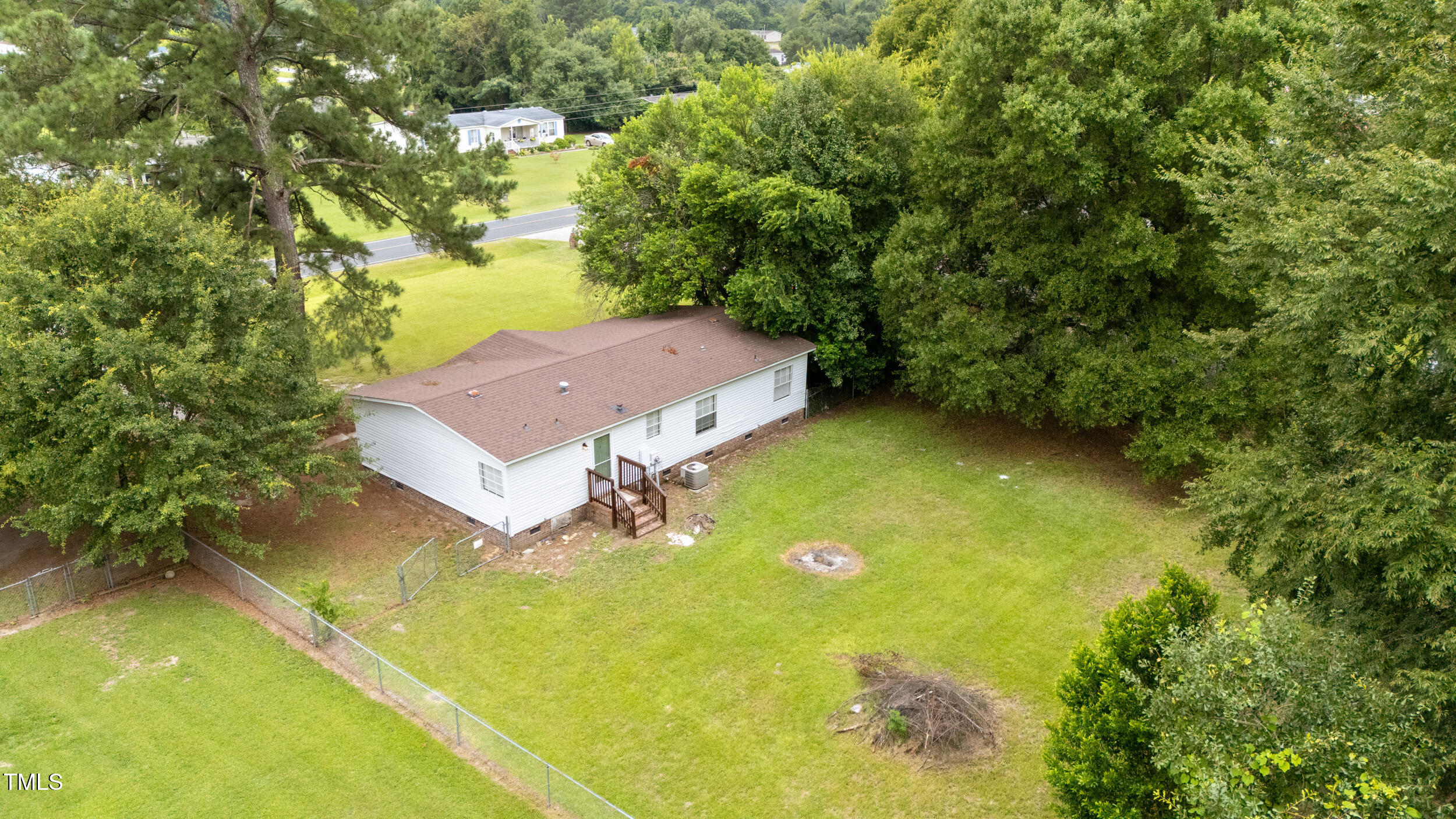 6423 Sandy Creek Road Stedman, NC 28391 - Photo 35 of 40 a view of a house with a yard