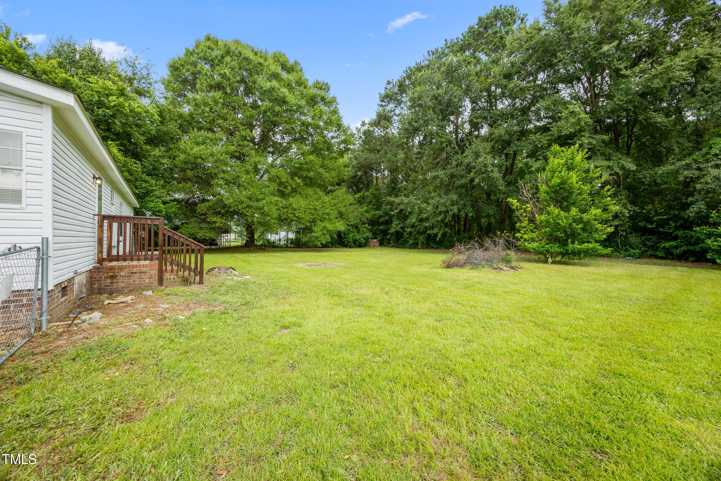 6423 Sandy Creek Road Stedman, NC 28391 - Photo 36 of 40 a view of a backyard with a small cabin