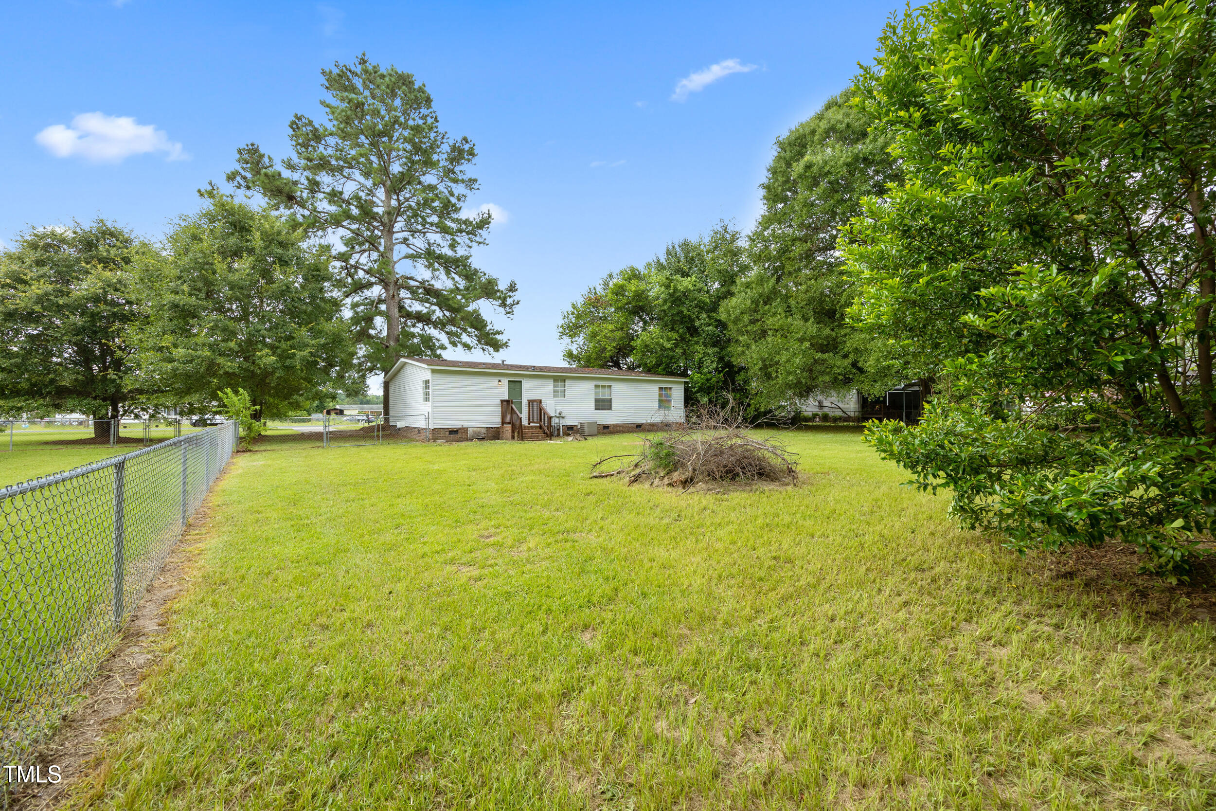 6423 Sandy Creek Road Stedman, NC 28391 - Photo 37 of 40 a view of a swimming pool with a patio