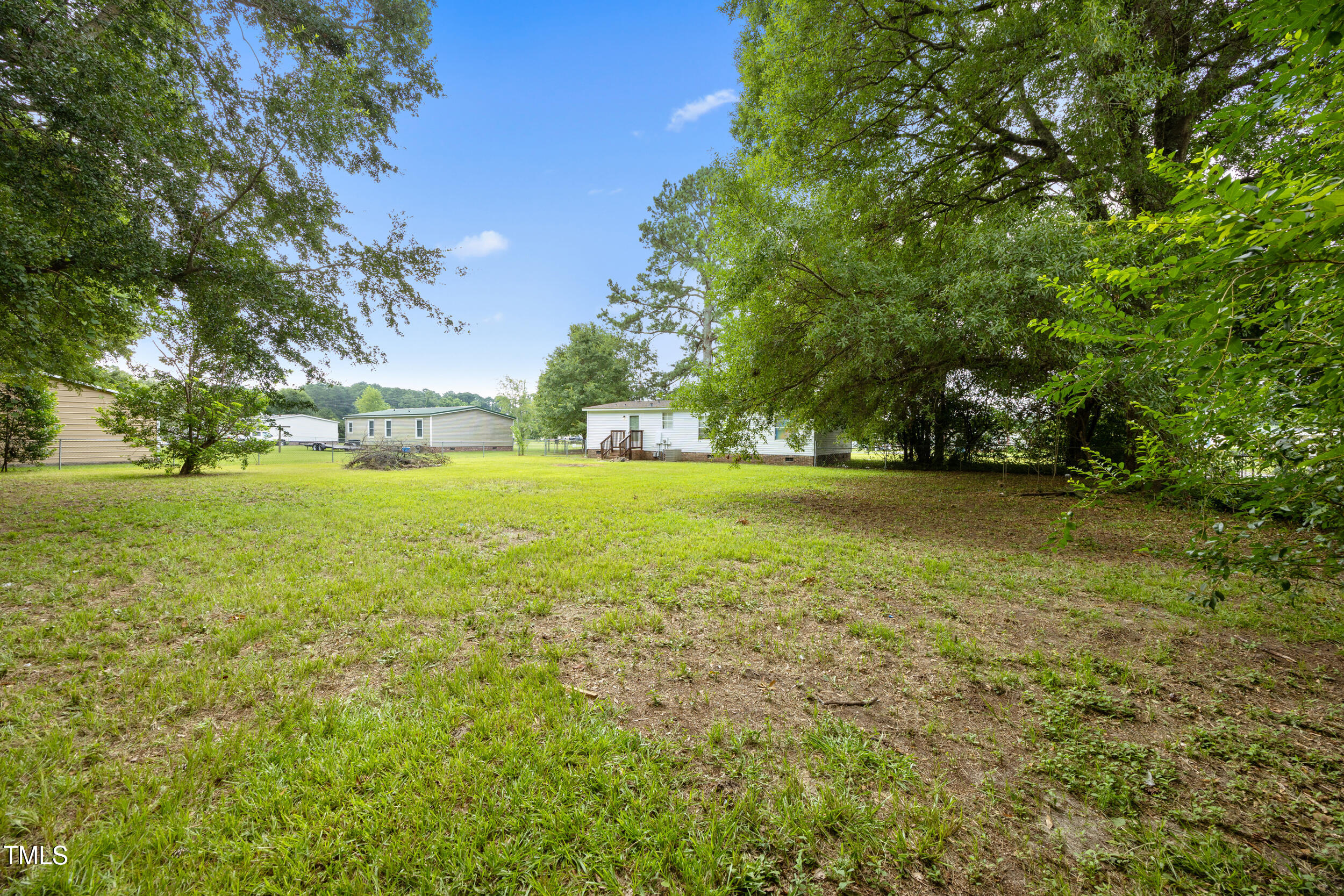 6423 Sandy Creek Road Stedman, NC 28391 - Photo 38 of 40 a view of an ocean from a yard