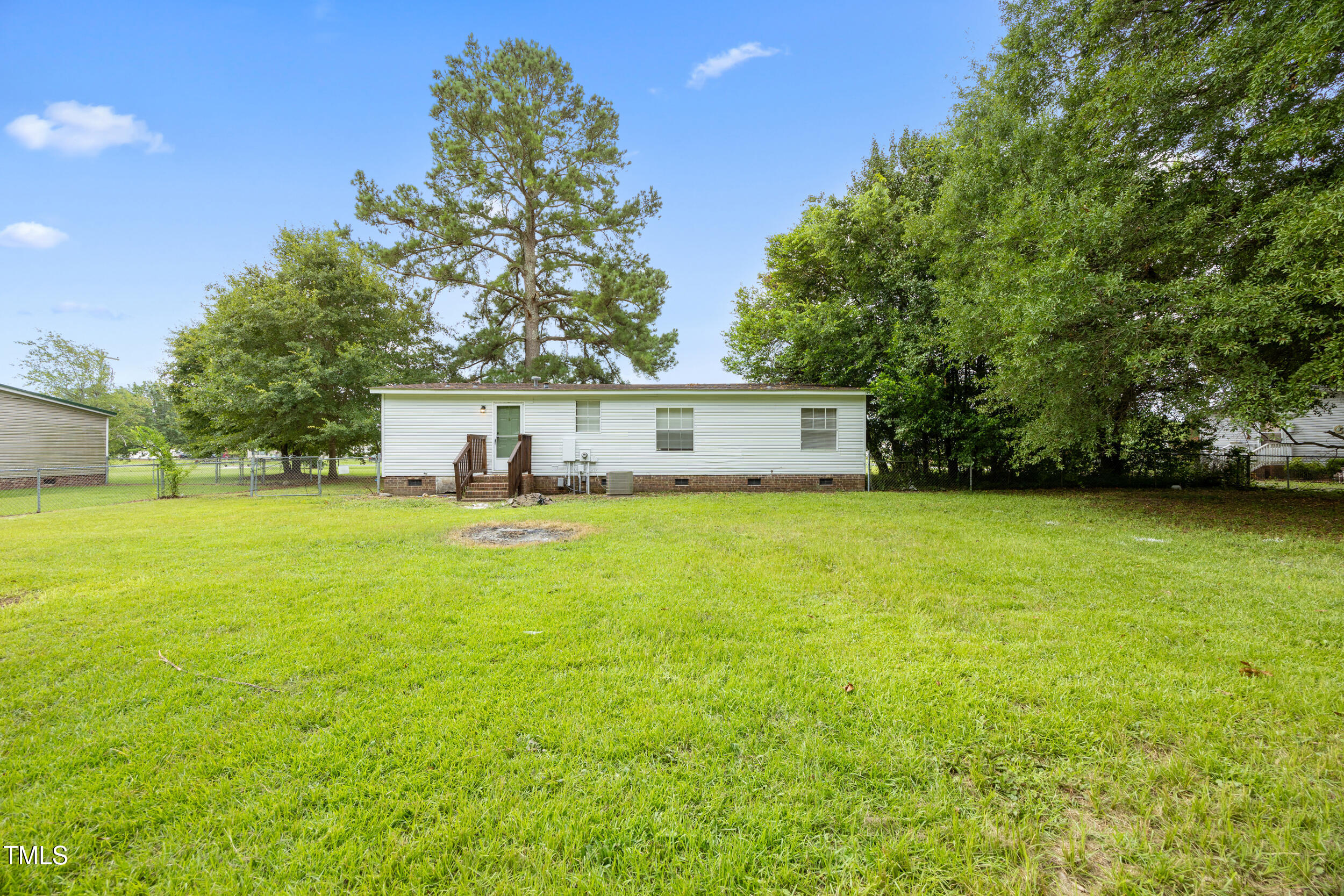 6423 Sandy Creek Road Stedman, NC 28391 - Photo 40 of 40 a view of a house with a yard