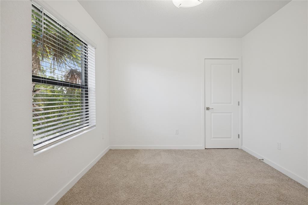 180 Southeast 5th Court Deerfield Beach, FL 33441 - Photo 13 of 25 a view of an empty room with a window