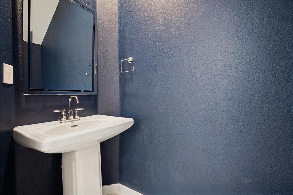 180 Southeast 5th Court Deerfield Beach, FL 33441 - Photo 15 of 25 a bathroom with a sink and a mirror