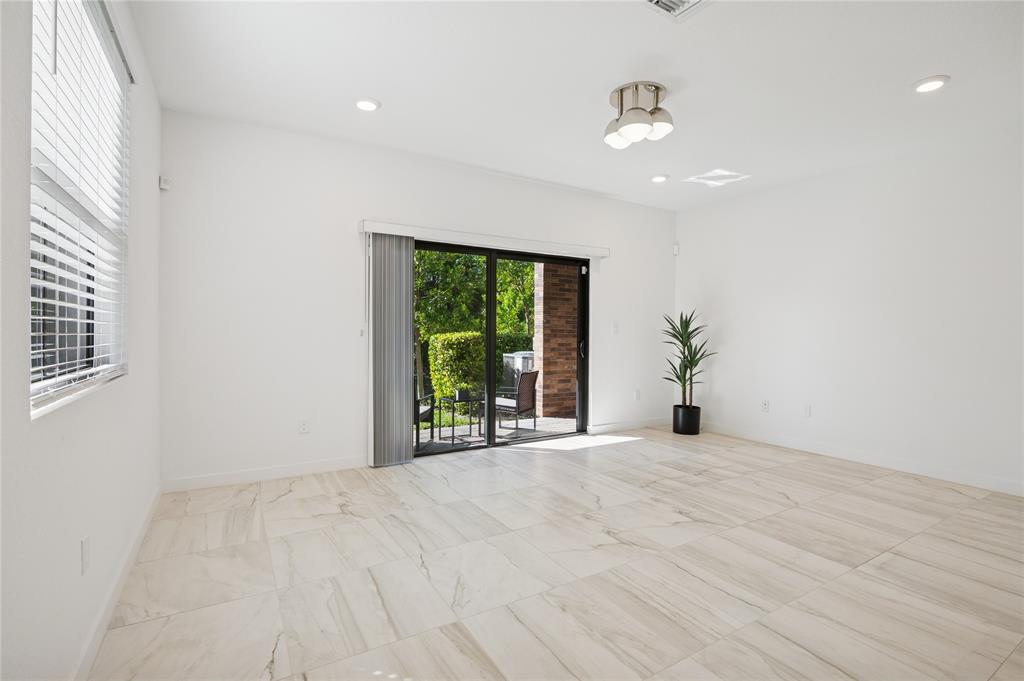 180 Southeast 5th Court Deerfield Beach, FL 33441 - Photo 8 of 25 a view of an empty room with a window