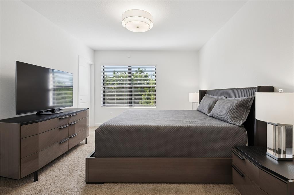 180 Southeast 5th Court Deerfield Beach, FL 33441 - Photo 10 of 25 a bedroom with a large bed and a flat screen tv