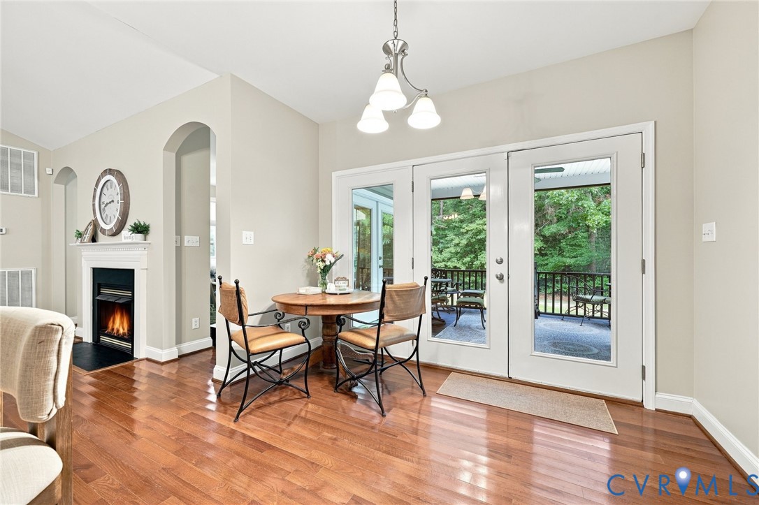 11318 River Road Chesterfield, VA 23838 - Photo 10 of 29 Hardwood-finish flooring, white fireplace with man