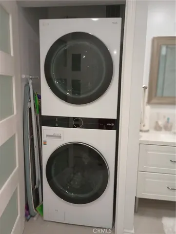 a bathroom with a shower sink and mirror