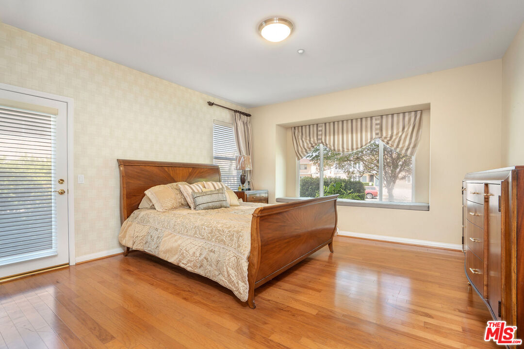 1128 West Duarte Road, Unit A Arcadia, CA 91007 - Photo 17 of 28 a large bed sitting in a room next to a window