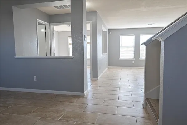 a view of livingroom with an empty space and window