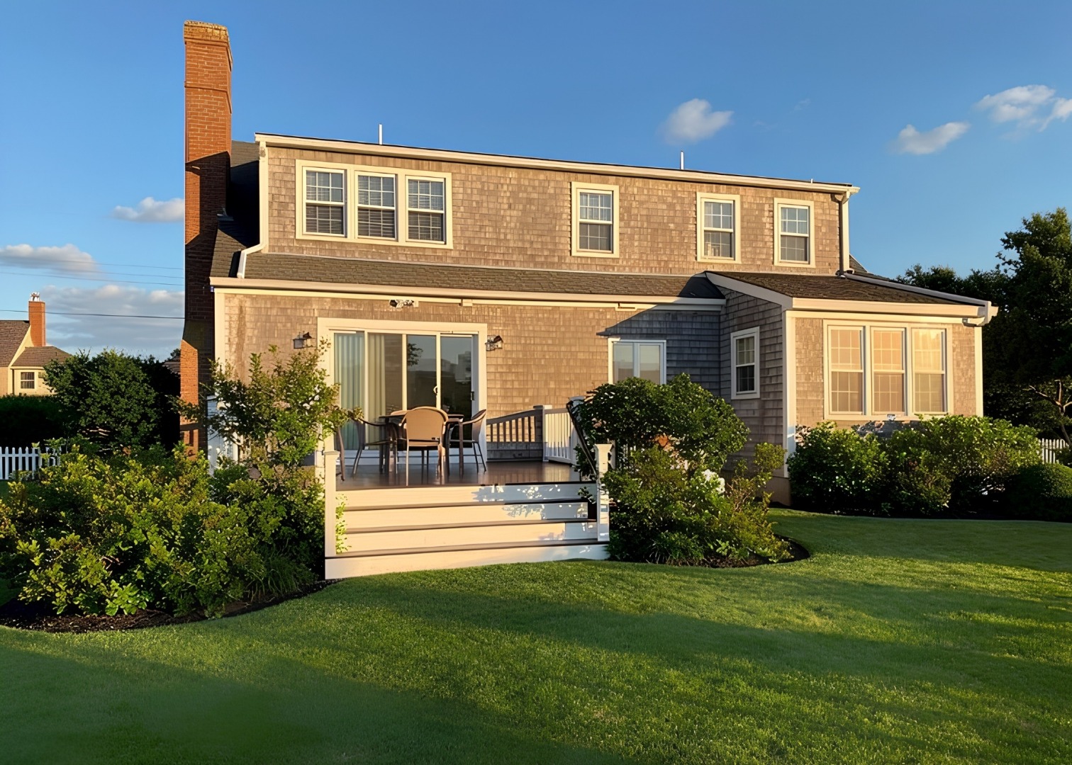 78 Baxter Road Nantucket, MA 02554 - Photo 10 of 14 a front view of a house with a garden