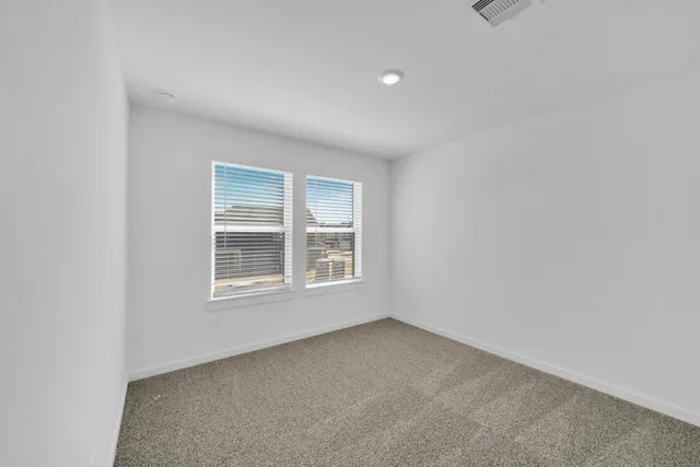 a bathroom with a double vanity sink a mirror and a shower