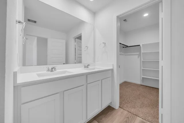 a bathroom with a glass shower door