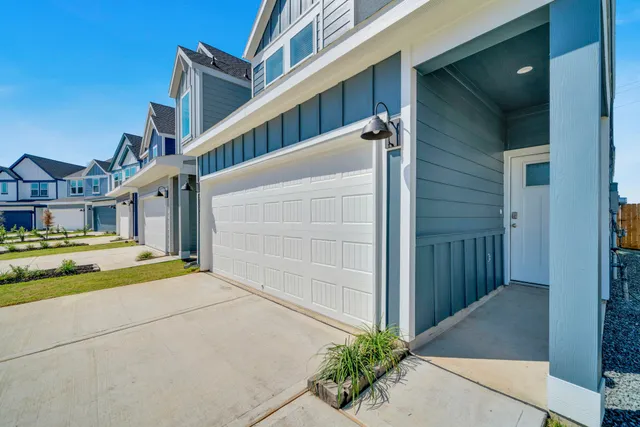 a view of a small space with wooden floor and a window