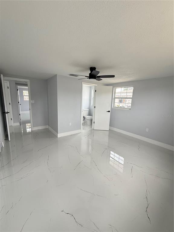 10433 Laburnum Drive Port Richey, FL 34668 - Photo 11 of 26 an empty room with a empty space and windows