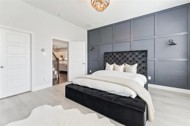 a bed sitting in a bedroom and closet