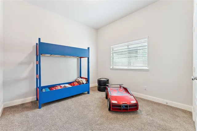 a room with bed and window