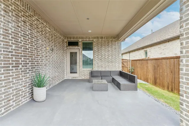 a lobby with furniture and potted plant