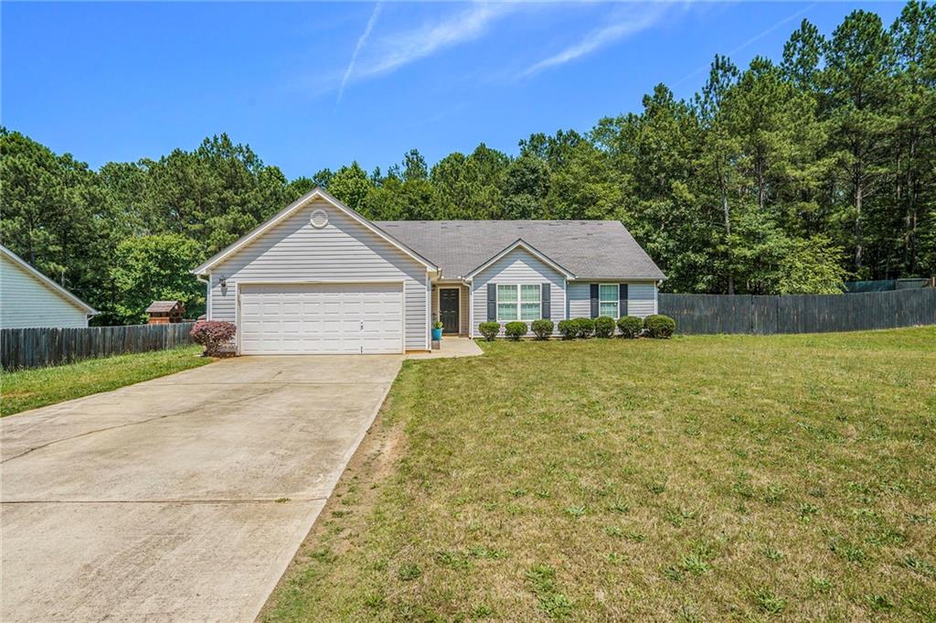 419 Southridge Road Winder, GA 30680 - Photo 1 of 1 a front view of a house with a yard