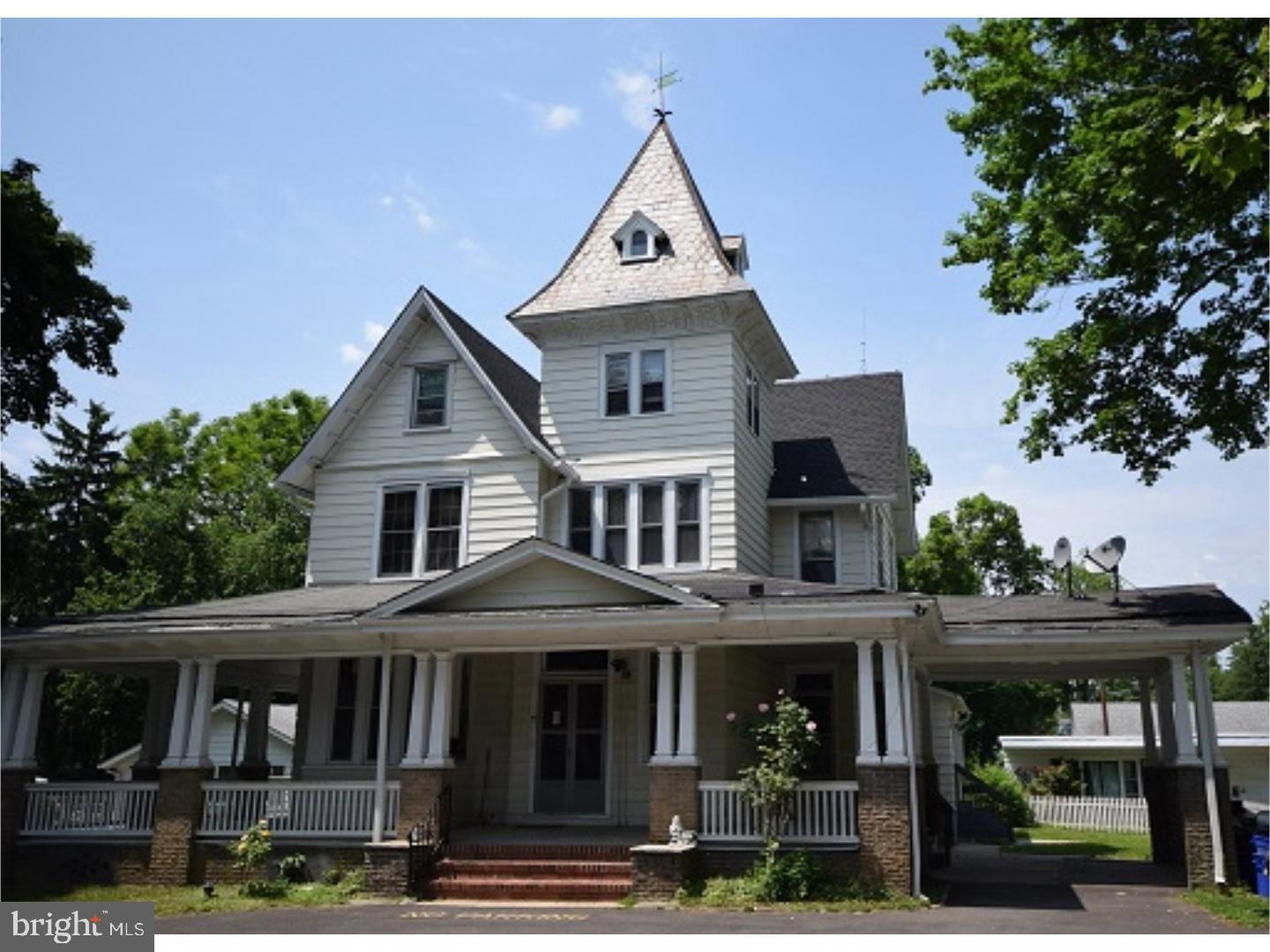 a front view of a residential apartment building with a yard