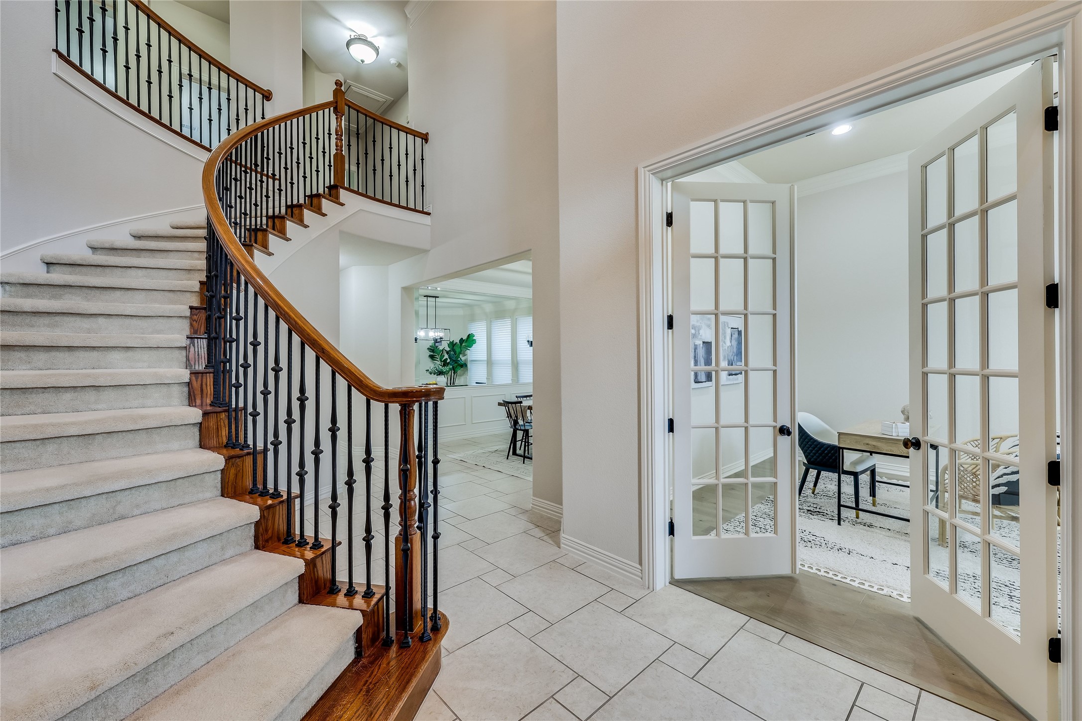 408 Ridgetop Bend Cedar Park, TX 78613 - Photo 29 of 40 A grand curved staircase with wrought iron balusters makes a statement in this inviting entry.