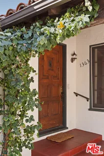 view of a potted plant with wooden wall