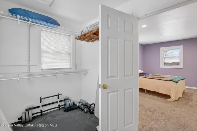 a bedroom with furniture and a window