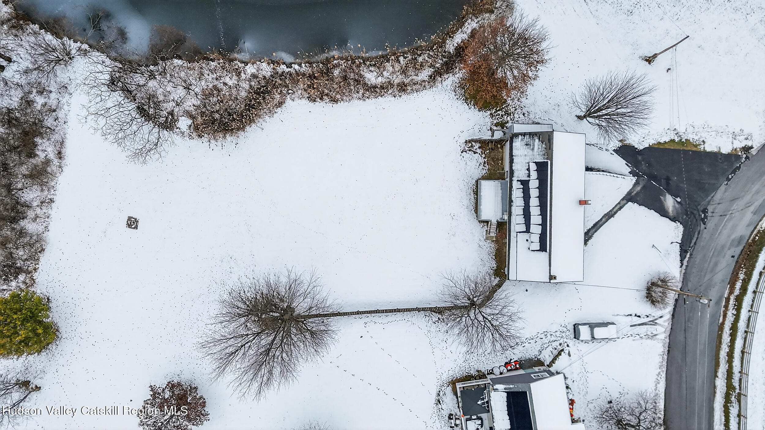 67 Picnic Woods Road Clintondale, NY 12515 - Photo 4 of 23 a vase of flowers sitting on a table in front of a house