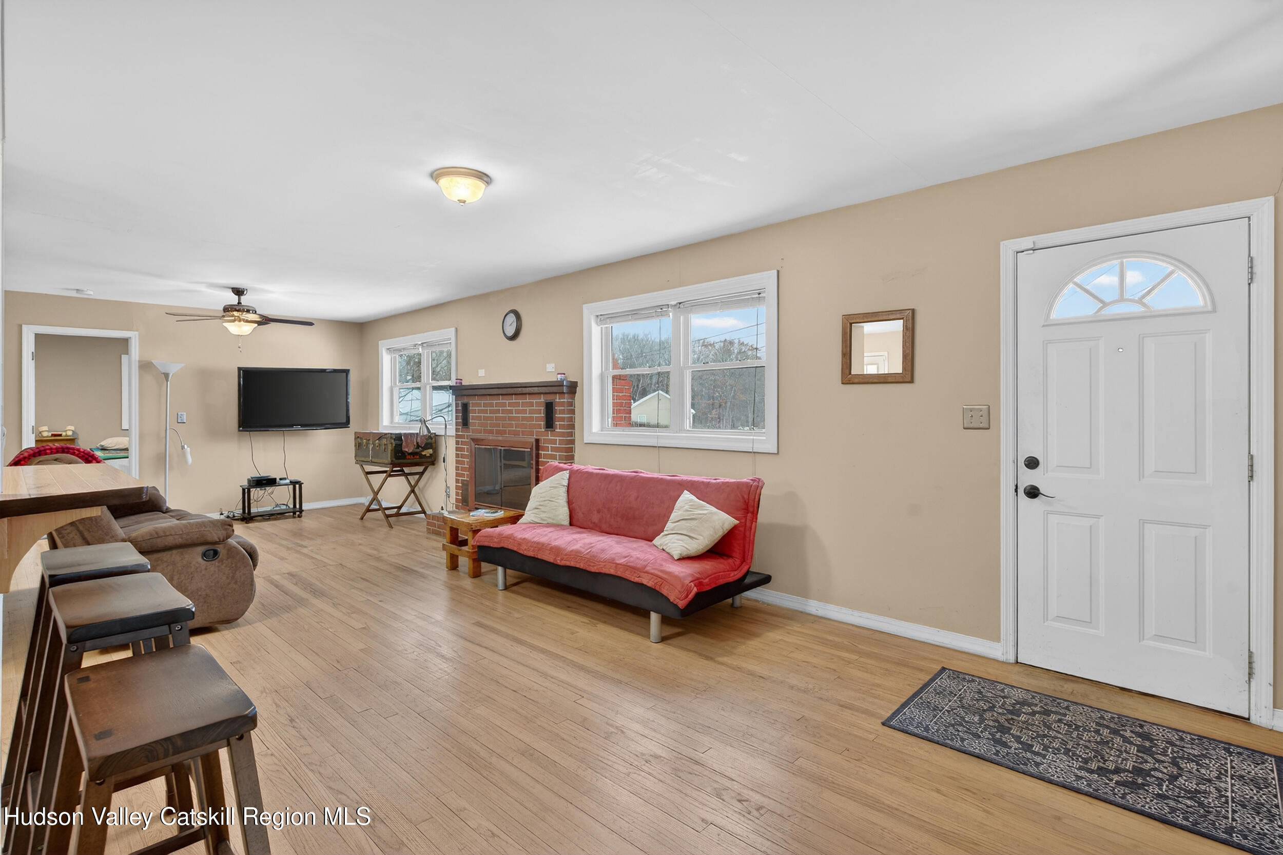 67 Picnic Woods Road Clintondale, NY 12515 - Photo 6 of 23 a living room with furniture and a flat screen tv