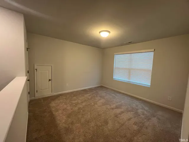 an empty room with a natural light