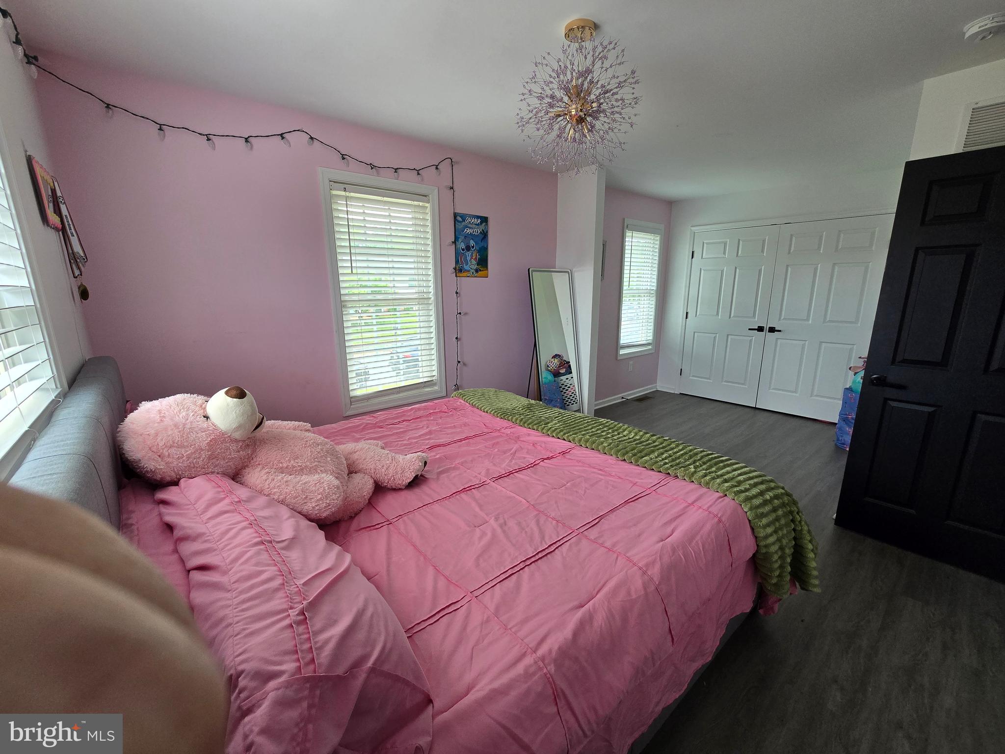 7513 Saffron Court Hanover, MD 21076 - Photo 17 of 42 a bedroom with a bed and a window