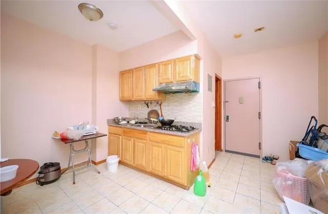 a kitchen with stainless steel appliances granite countertop a sink and cabinets